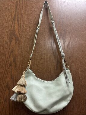 Urban Originals Crescent Hobo Bag in Sage Green with Tassel